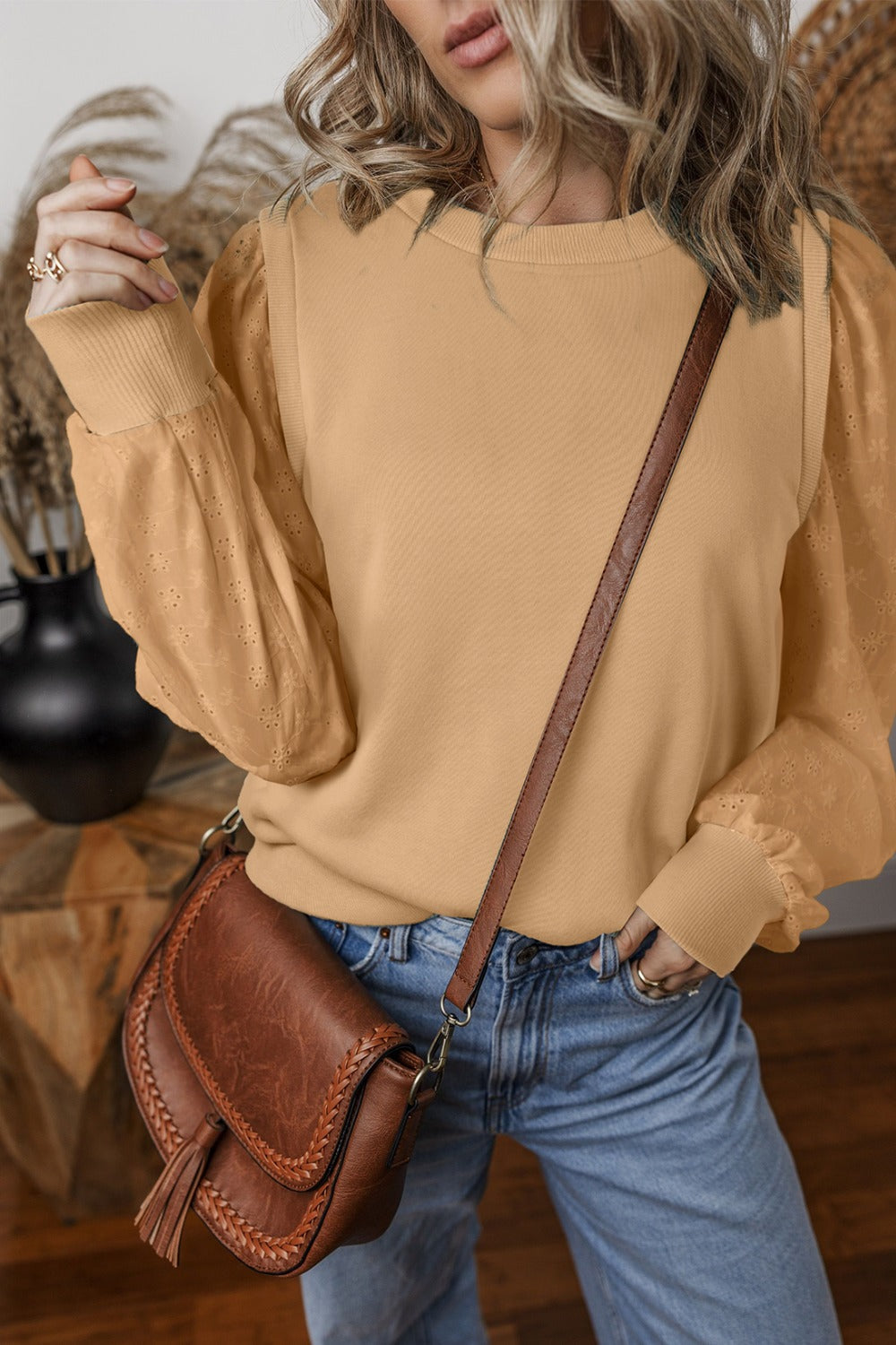  Eyelet Round Neck Long Sleeve Sweatshirt.