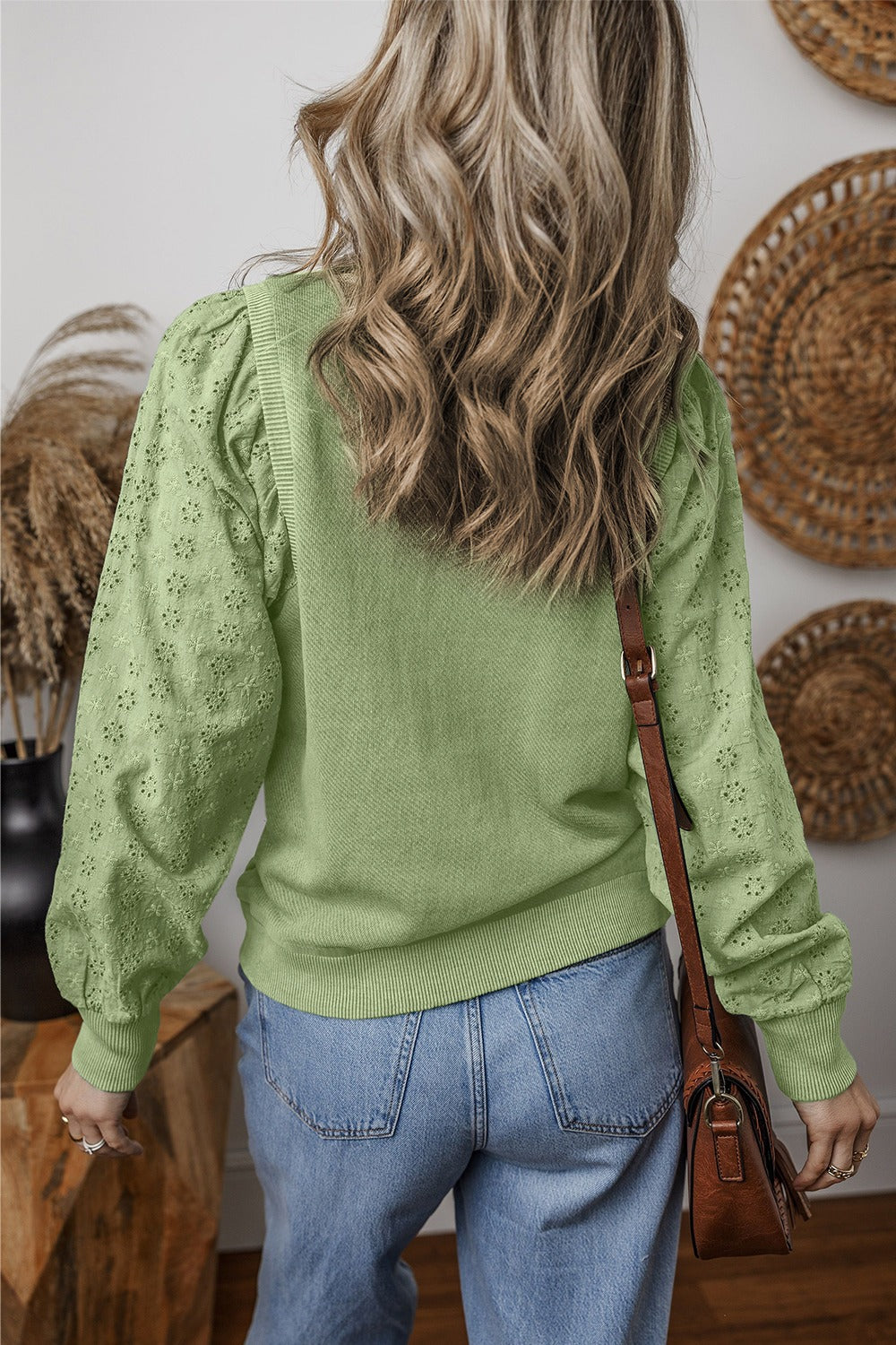  Eyelet Round Neck Long Sleeve Sweatshirt.