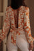 Orange Floral Print Knotted Backless Long Sleeve Blouse