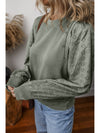  Eyelet Round Neck Long Sleeve Sweatshirt.