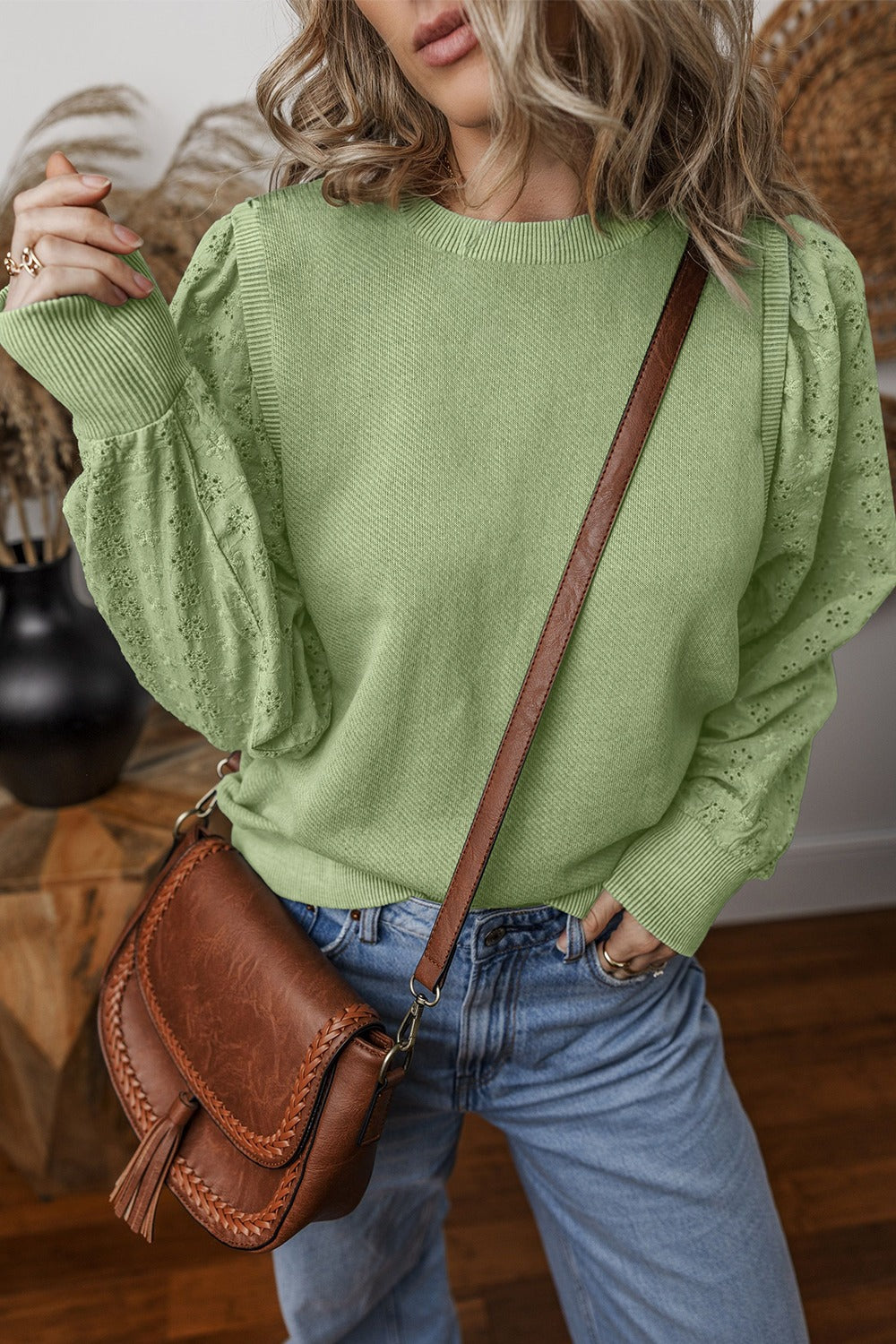  Eyelet Round Neck Long Sleeve Sweatshirt.