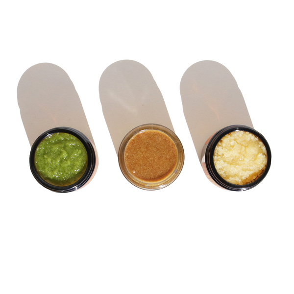 Three cylindrical containers with different substances on a white background